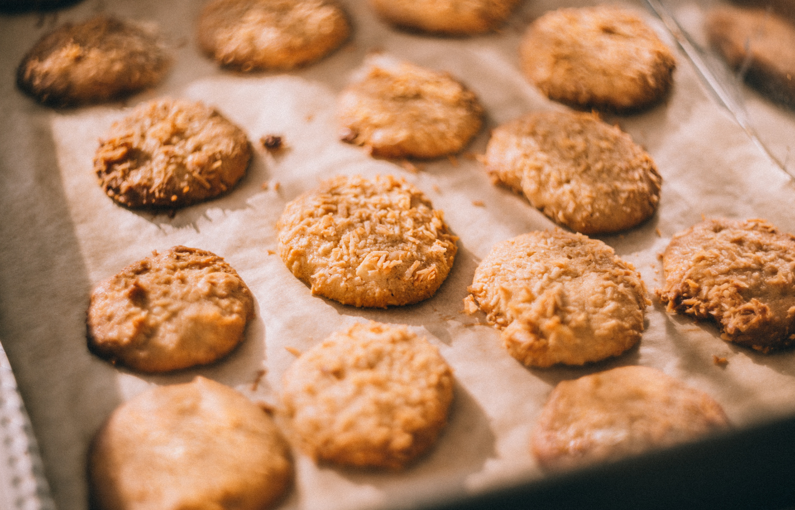 A freshly baked sheet of cookies, golden brown and ready to be enjoyed during the festive Cookies with Santa event.