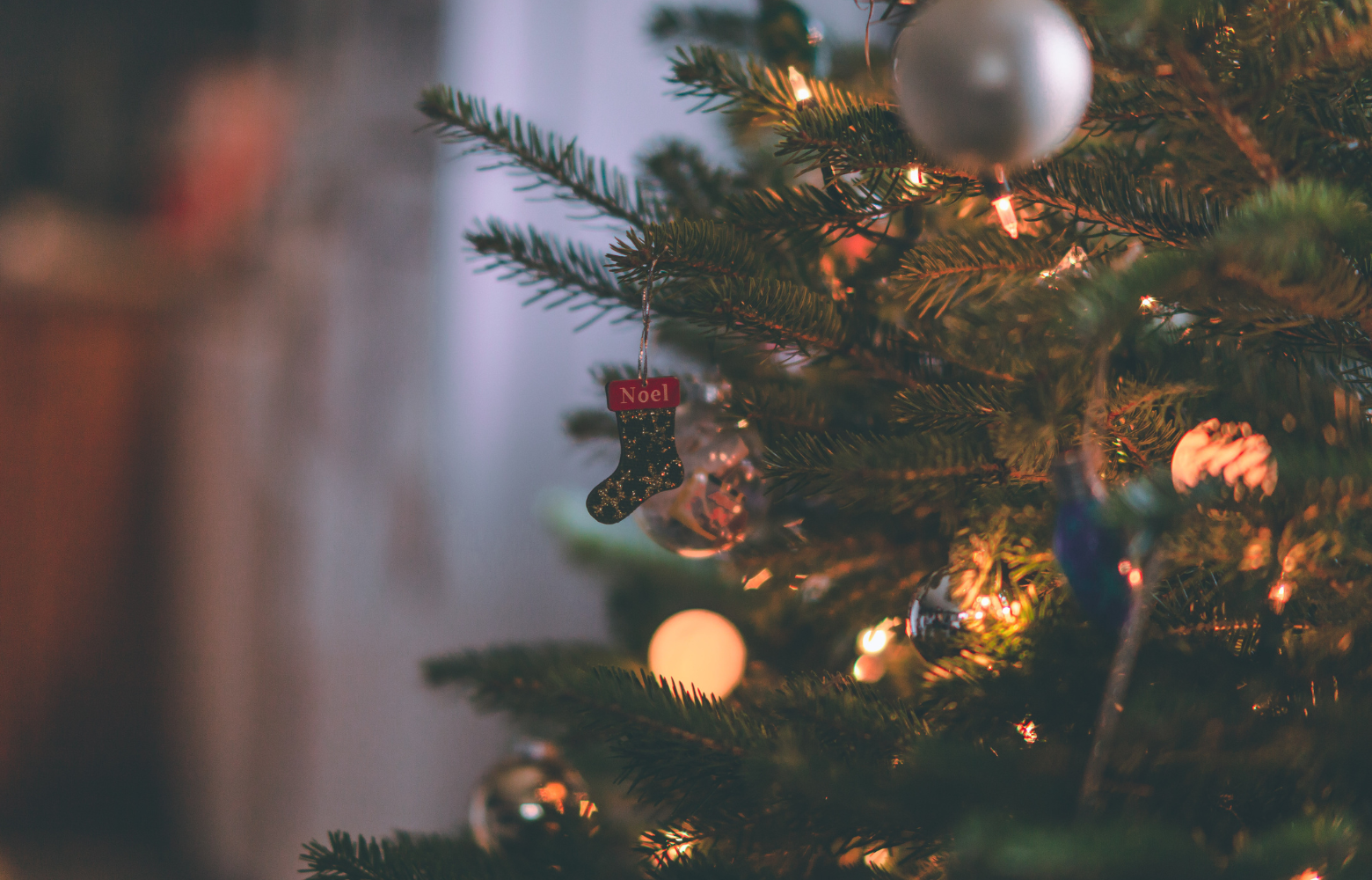 A beautifully decorated Christmas tree, twinkling with lights and ornaments, embodying the festive spirit of the season.